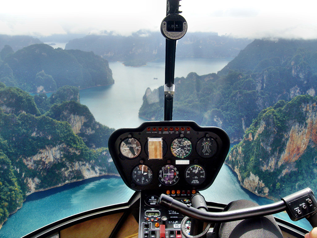 Survey the islands around Phuket from a helicopter. Image copyright:...