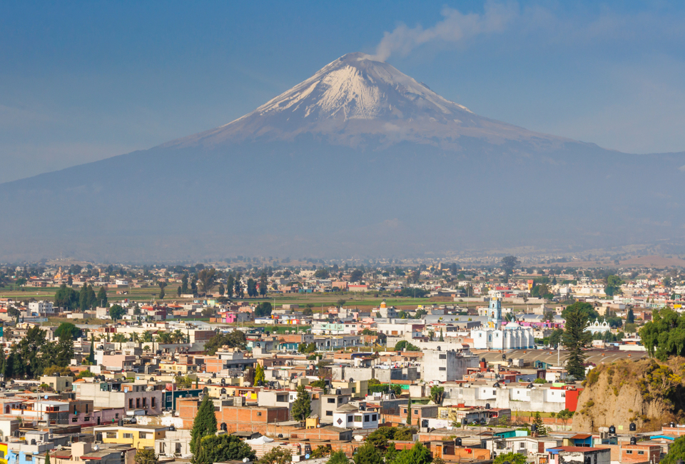 El Popocatepetl, a snow-capped volcano that towers over Puebla.